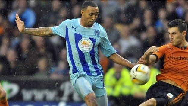 Callum Wilson (left) shoots for Coventry