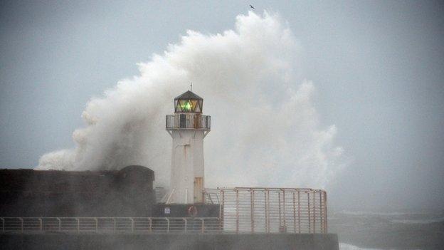 Waves crashing over lighthouse at Ardrossan