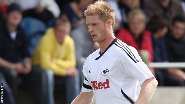 Swansea defender Alan Tate has signed for Aberdeen