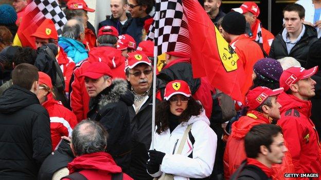 Fans gather outside the Grenoble University Hospital Centre to mark the 45th birthday of former German Formula One driver Michael Schumacher (3 Jan 2014)