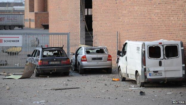 Damaged cars near the site where a World War II (WWII) bomb exploded in Euskirchen