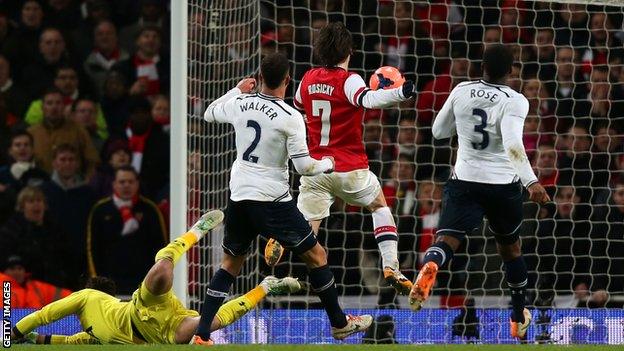 Arsenal midfielder Tomas Rosicky scores