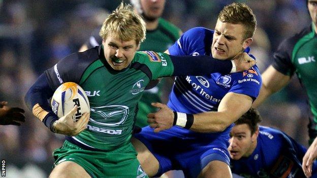 Connacht try-scorer Fionn Carr attempt to fend off Ian Madigan