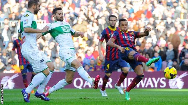 Alexis Sanchez scores three goals as Barcelona beat Elche to go top of La Liga.