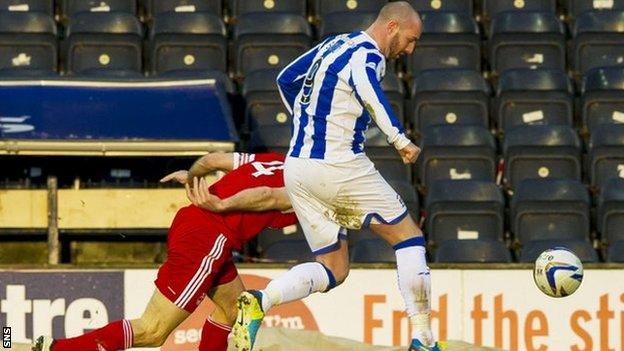 Russell Anderson is challenged by Kris Boyd