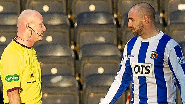 Referee Craig Charleston is questioned by Kris Boyd