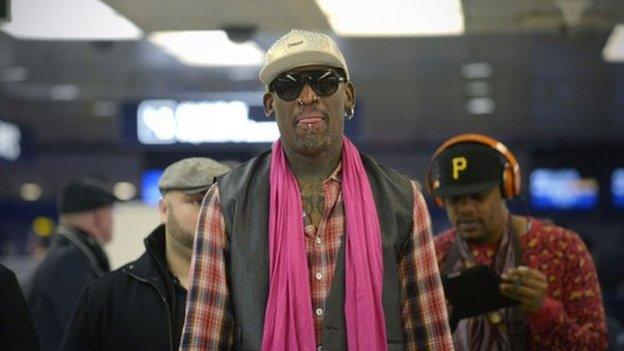 Dennis Rodman checks in at Beijing airport for his flight to Pyongyang on 6 January 2014