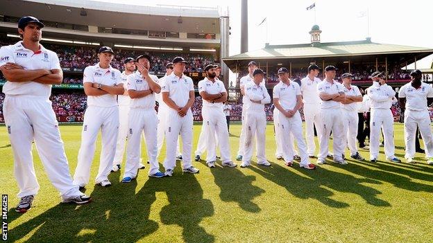 England captain Alastair Cook (left) and his players after defeat in Australia