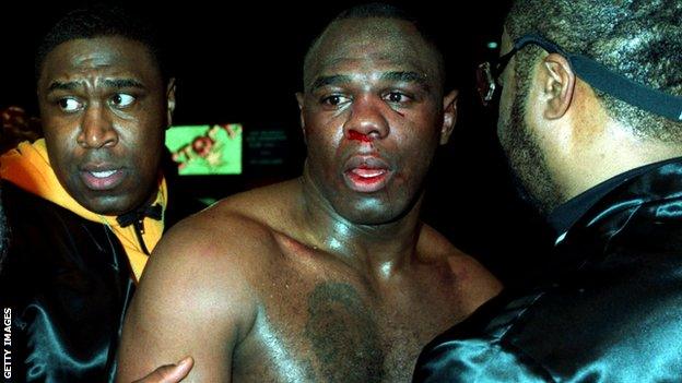 19 MAR 1994: MICHAEL BENTT OF THE USA IS LED AWAY BY HIS CORNERMEN, BADLY SHAKEN AND WITH HIS FACE BLOODIED, AFTER LOSING HIS WBO HEAVYWEIGHT TITLE FIGHT TO HERBIE HIDE OF GREAT BRITAIN.