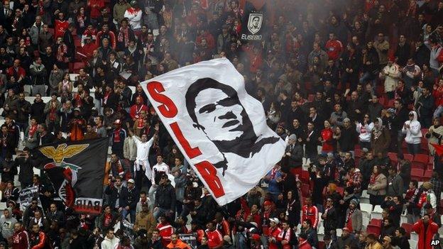 Benfica supporters cheer in tribute to Eusebio, who died on 6 January 2014