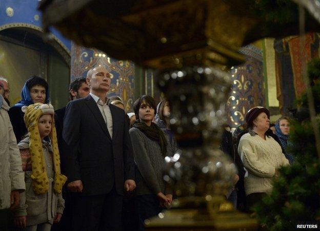 Russian President Vladimir Putin in church in Sochi, 6 January