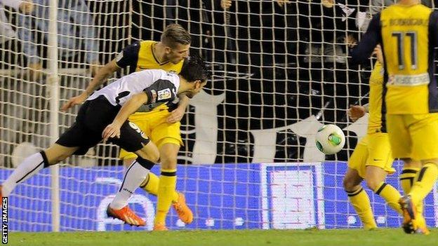 Helder Postiga heads in Valencia's equaliser