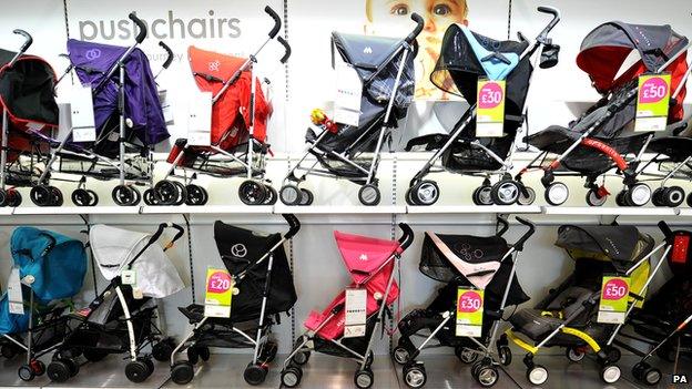 Pushchairs on sale at a Mothercare store