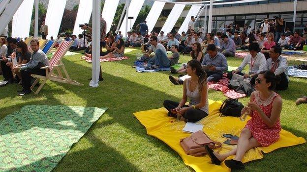 People listening to entrepreneurs pitching ideas at LAB 4+ summit