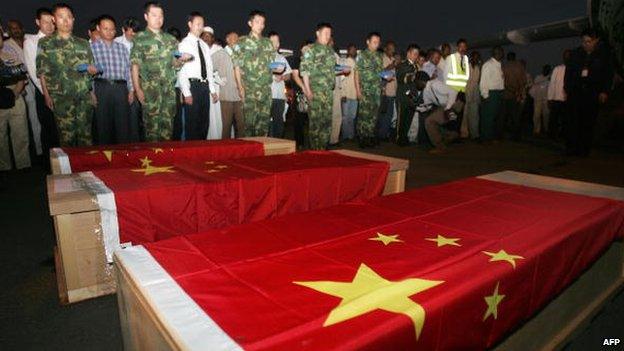 The coffins of Chinese oil workers killed in a kidnapping in Sudan - October 2008