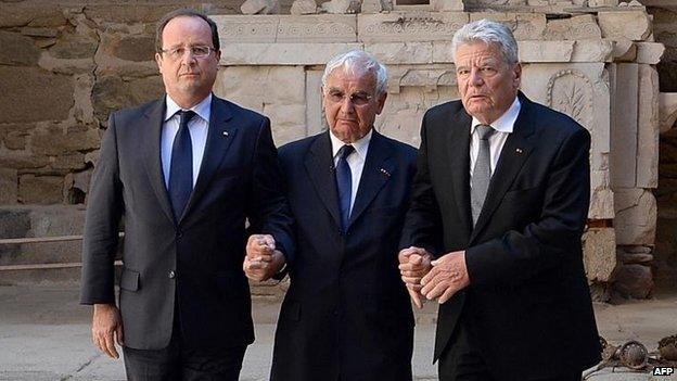 Francois Hollande (left) with German counterpart Joachim Gauck (right) and survivor Robert Hebras, 4 Sept