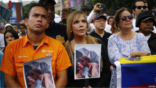 Demonstrators with pictures of Ms Spear