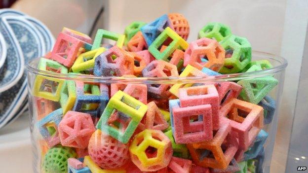 3D printed sweets. The sweets are unusual shapes, like 3D hollow cubes and pyramids.