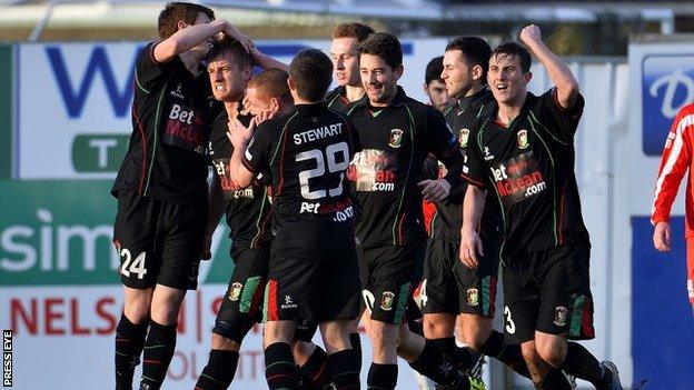 Glentoran celebrate one of their three goals at Portadown