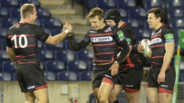 Tom Brown is congratulated for his first-half try