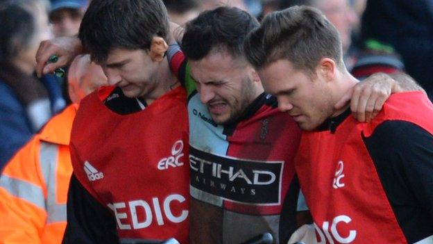 Danny Care is helped off the pitch