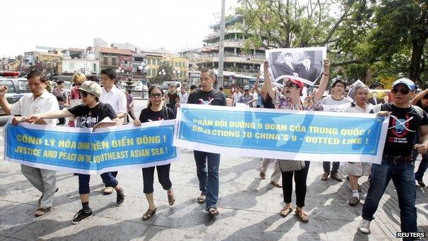 Protesters chant anti-China slogans while marching in Hanoi on 2 June 2013