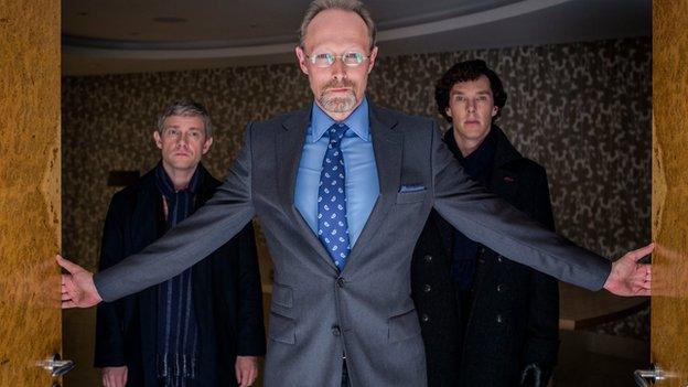 Martin Freeman as John Watson, Lars Mikkelsen as Charles Magnussen and Benedict Cumberbatch as Sherlock Holmes