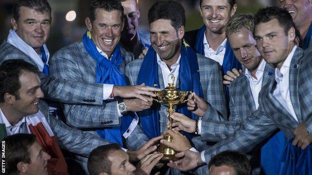 Members of Team Europe pose with the Ryder Cup after the final day of the 39th Ryder Cup at the Medinah Country Club September 30, 2012