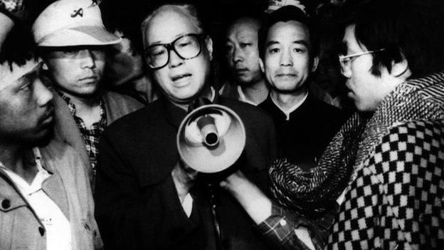 In this 19 May 1989 file photo, Communist Party General Secretary Zhao Ziyang, centre with megaphone, speaks with fasting university students in Beijing's Tiananmen Square, the last time he was seen in public