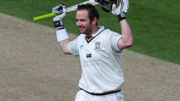 Durham opening batsman Mark Stoneman celebrates reaching his century