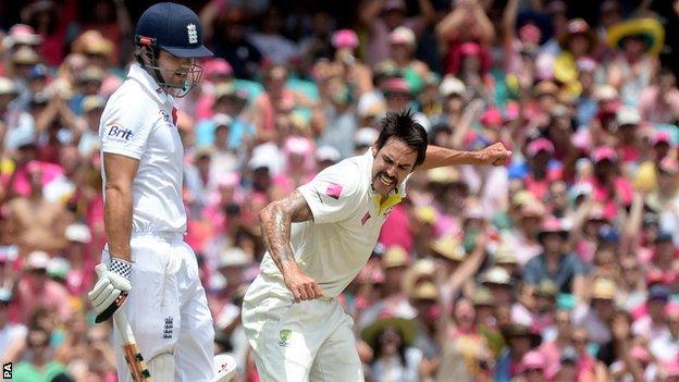 England captain Alastair Cook (left) is dismissed by Australia bowler Mitchell Johnson during the Ashes