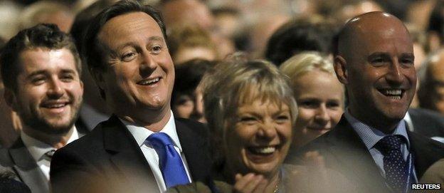 David Cameron among the crowd at the party conference watching a Boris Johnson speech