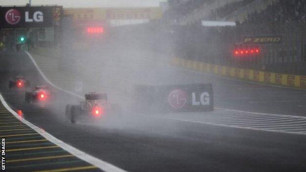 Cars approach a corner at the Brazil Grand Prix