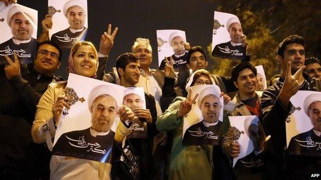 Iranians flashing the sign for victory as the Iranian delegation arrived at Tehran's Mehrabad Airport after signing the agreement in Geneva.