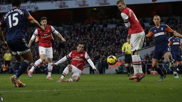 Santi Cazorla (centre) scores the opener for Arsenal against Fulham