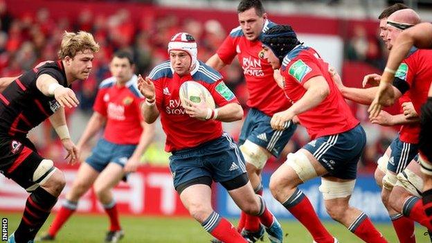 Johne Murphy steps inside Dave Denton to score Munster's second try