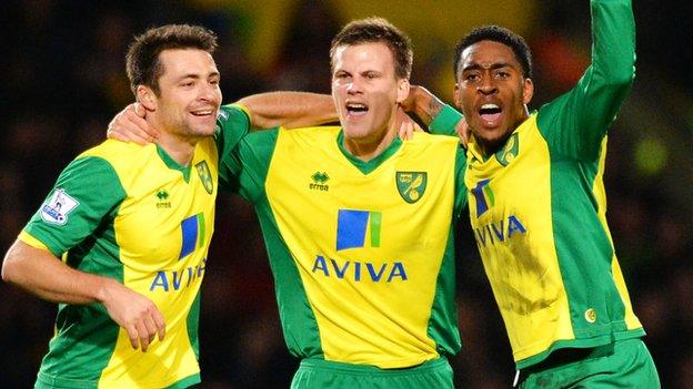 Ryan Bennett celebrates with Russell Martin and Leroy Fer