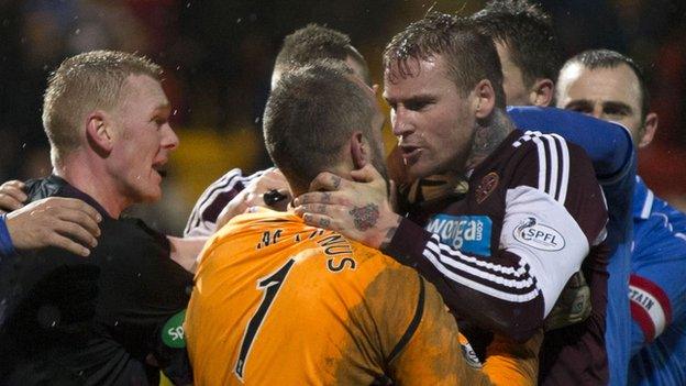 Alan Mannus and Ryan Stevenson clash at McDiarmid Park