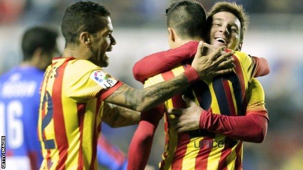 Barcelona's forward Cristian Tello (second right) celebrates his third goal with Barcelona"s Argentine forward Lionel Messi (right)