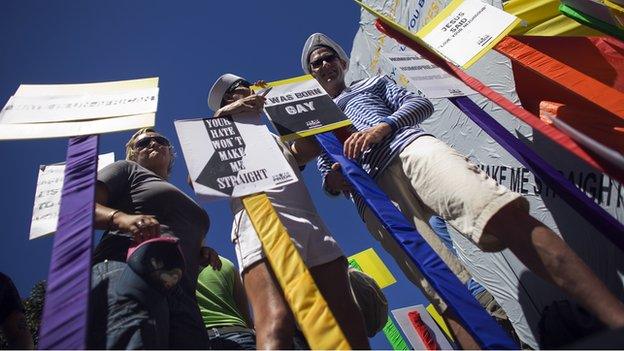 People parade in the streets of Cape Town's business district on 6 March 2010 during the annual Gay Pride parade