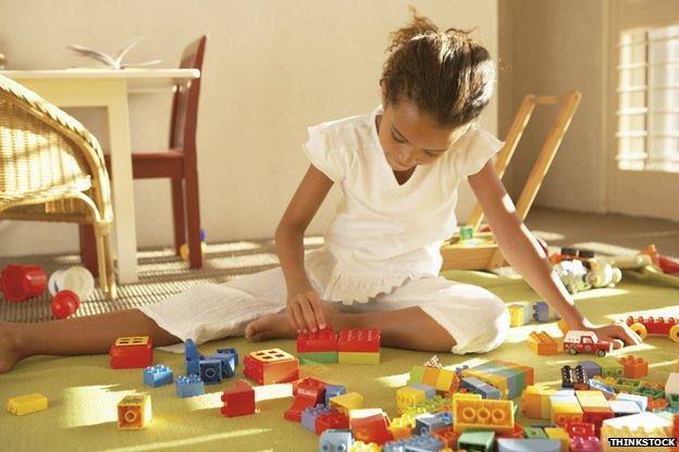 Girl playing with lego