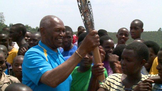 Kip Keino with the Queen's Baton