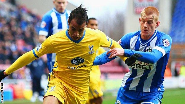 Wigan goalscorer Ben Watson in action against Crystal Palace's Marouane Chamakh at the DW Stadium