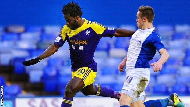 Swansea's Wilfried Bony takes on Birmingham's Mitch Hancox