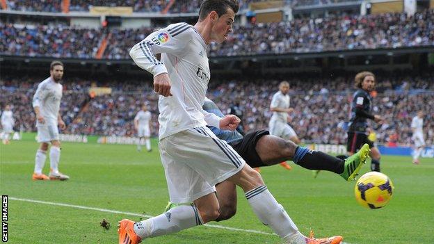 Gareth Bale had to be substituted at half time for Real Madrid, who won 2-0 to go top of La Liga.