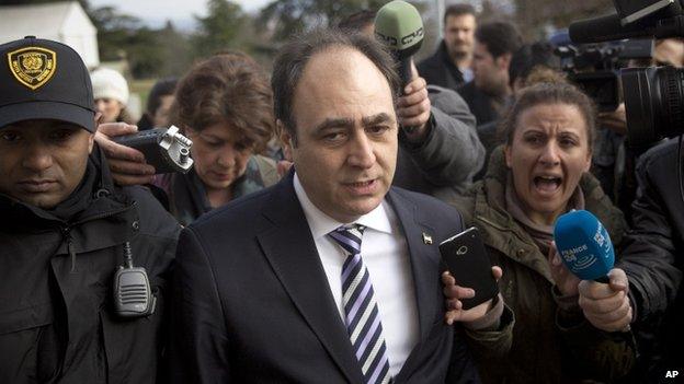 National Coalition of Syria representative Monzer Akbi outside the talks in Geneva (26 Jan)