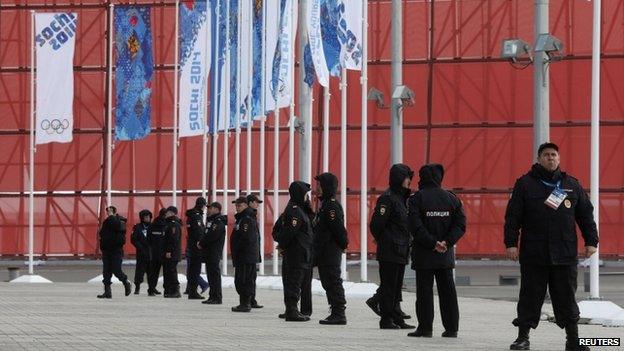 Russian police officers stand guard at the Olympic Park in the Adler district of Sochi, January 26, 2014