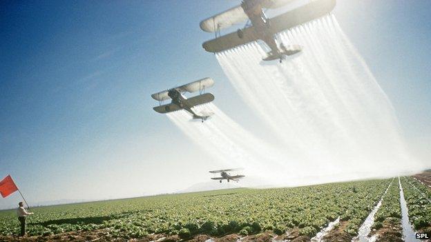 Planes dusting crops with pesticides