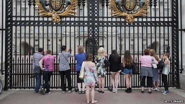 Tourists stood outside Buckingham Palace gates