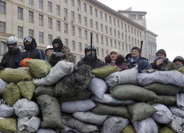 Protesters man a barricade in Kiev, 28 January